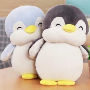 Poupée en peluche pingouin heureux